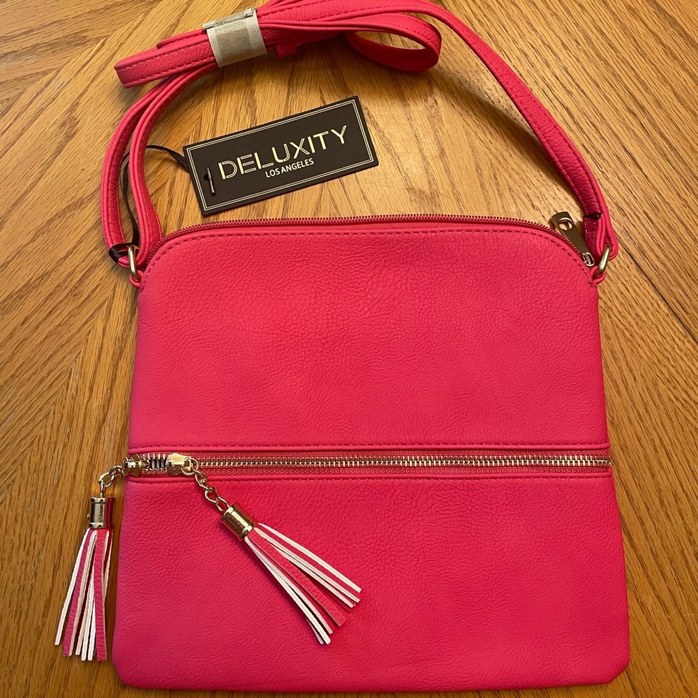 Womens crossbody, brand new with tags. Never used
